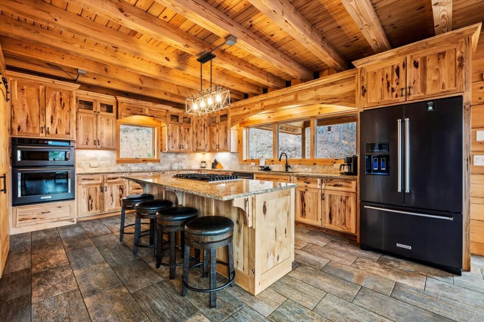 This beautifully designed kitchen offers all the modern conveniences while embracing the charm of a Smoky Mountain retreat. Enjoy mountain views as you cook and entertain!