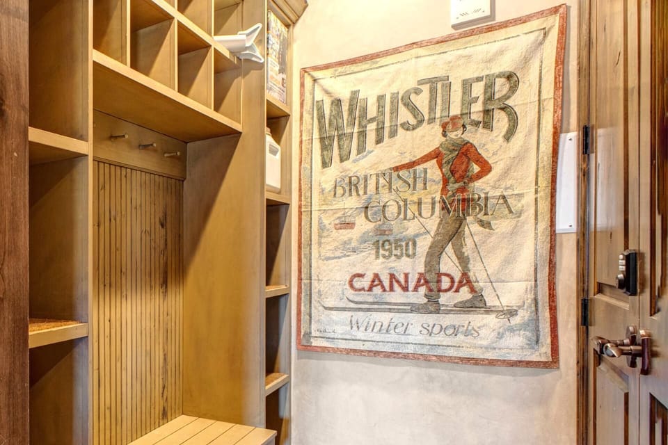 Vintage Whistler ski poster adds charm to cozy mudroom nook. VIN-14