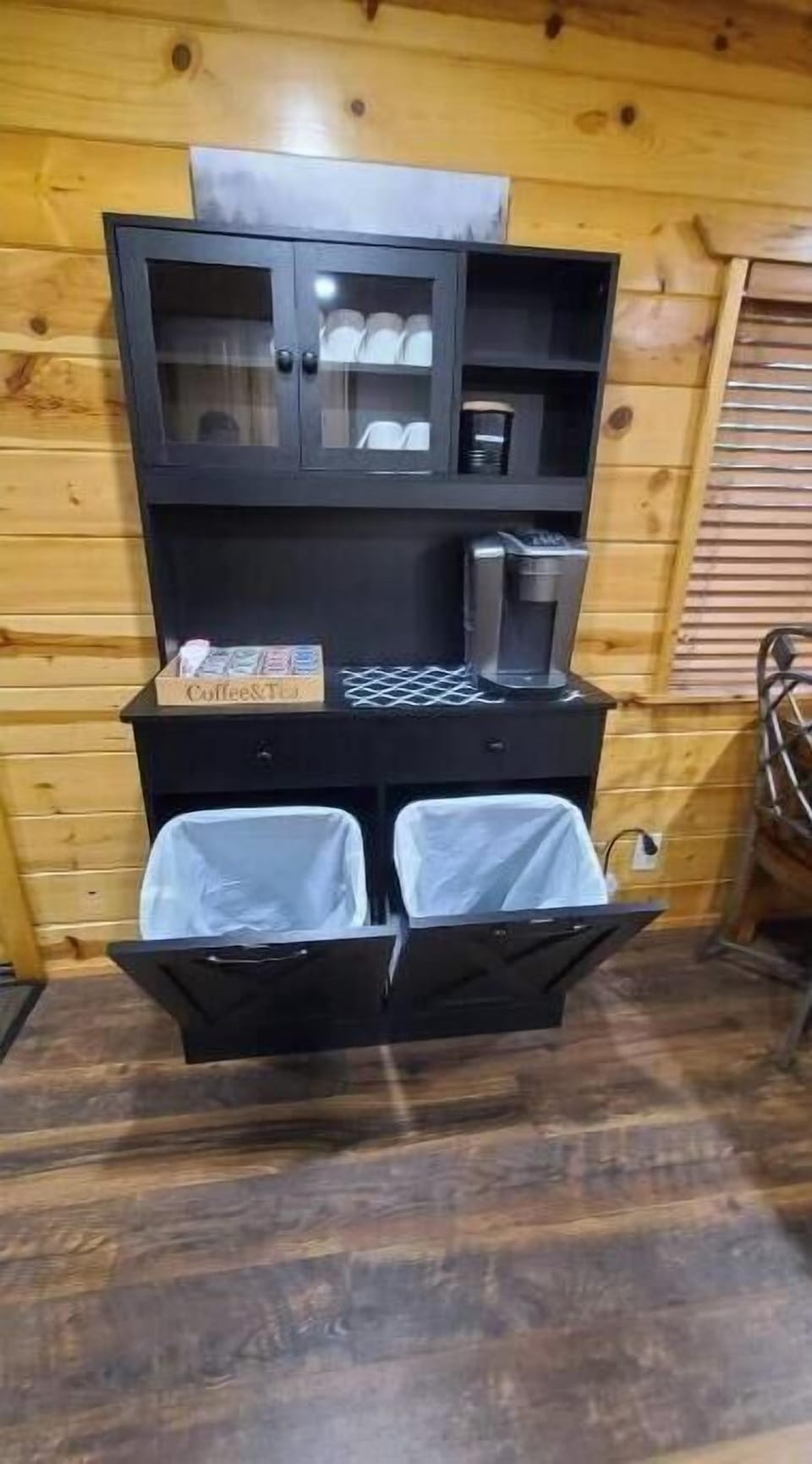 Coffee bar and trash cans.