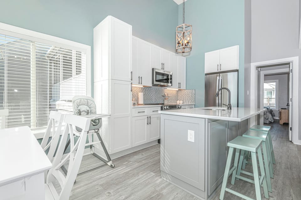 Bright and airy dining nook, perfect for family meals, featuring large windows