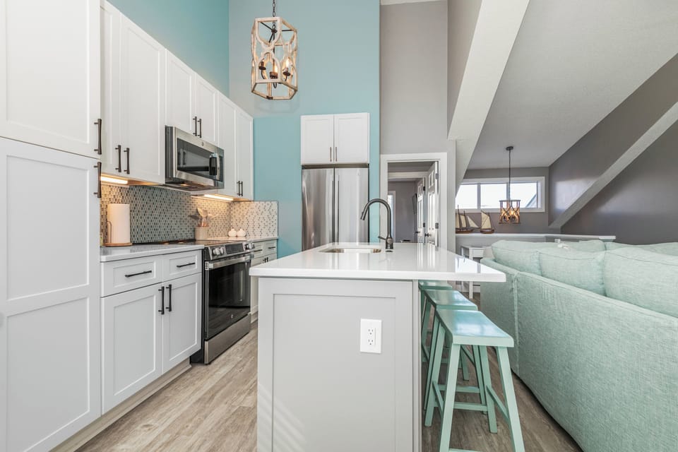 Fully equipped kitchen featuring sleek countertops