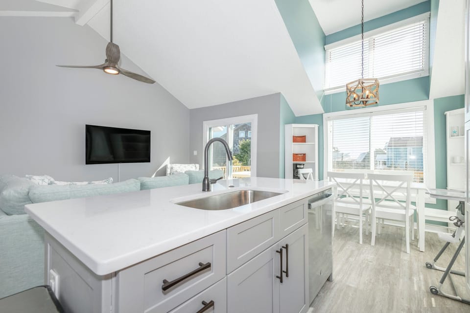 A fully equipped kitchen with high-end finishes and plenty of counter space for cooking.