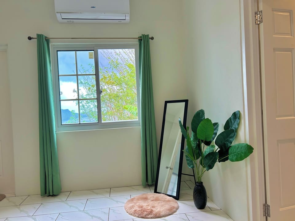 Air-conditioned master room. Features netted windows & access to patio and pool.