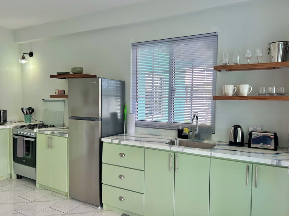 Features a microwave, kettle & toaster.