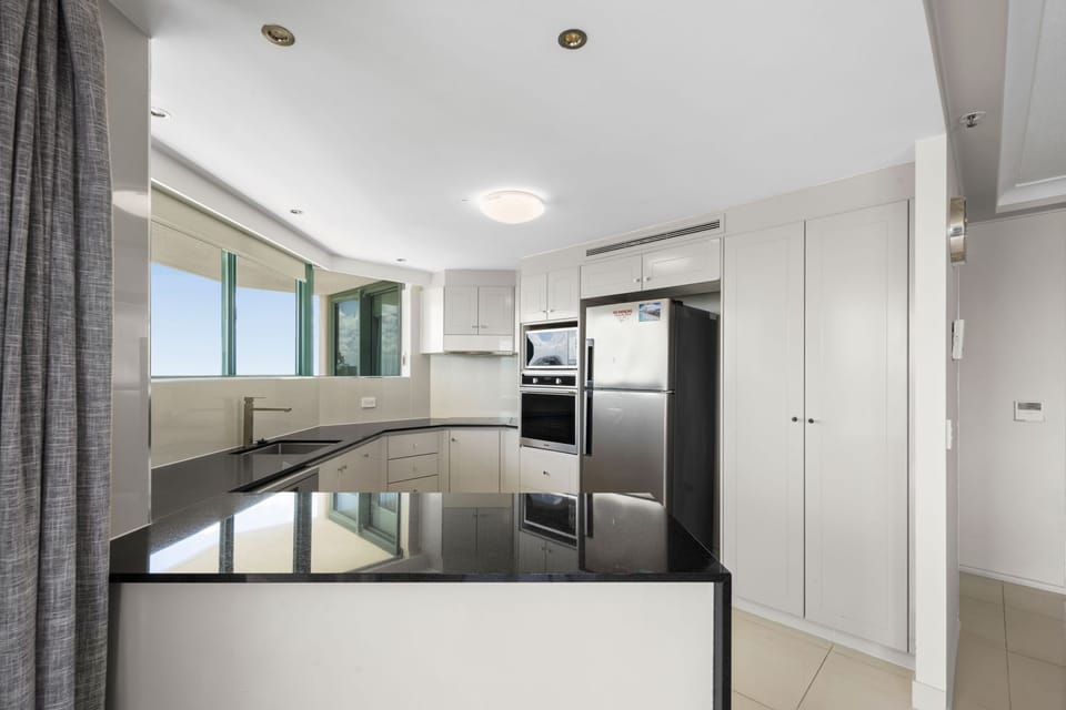Deluxe Apartment, Balcony, Sea View | Private kitchen | Electric kettle, toaster, cleaning supplies, freezer