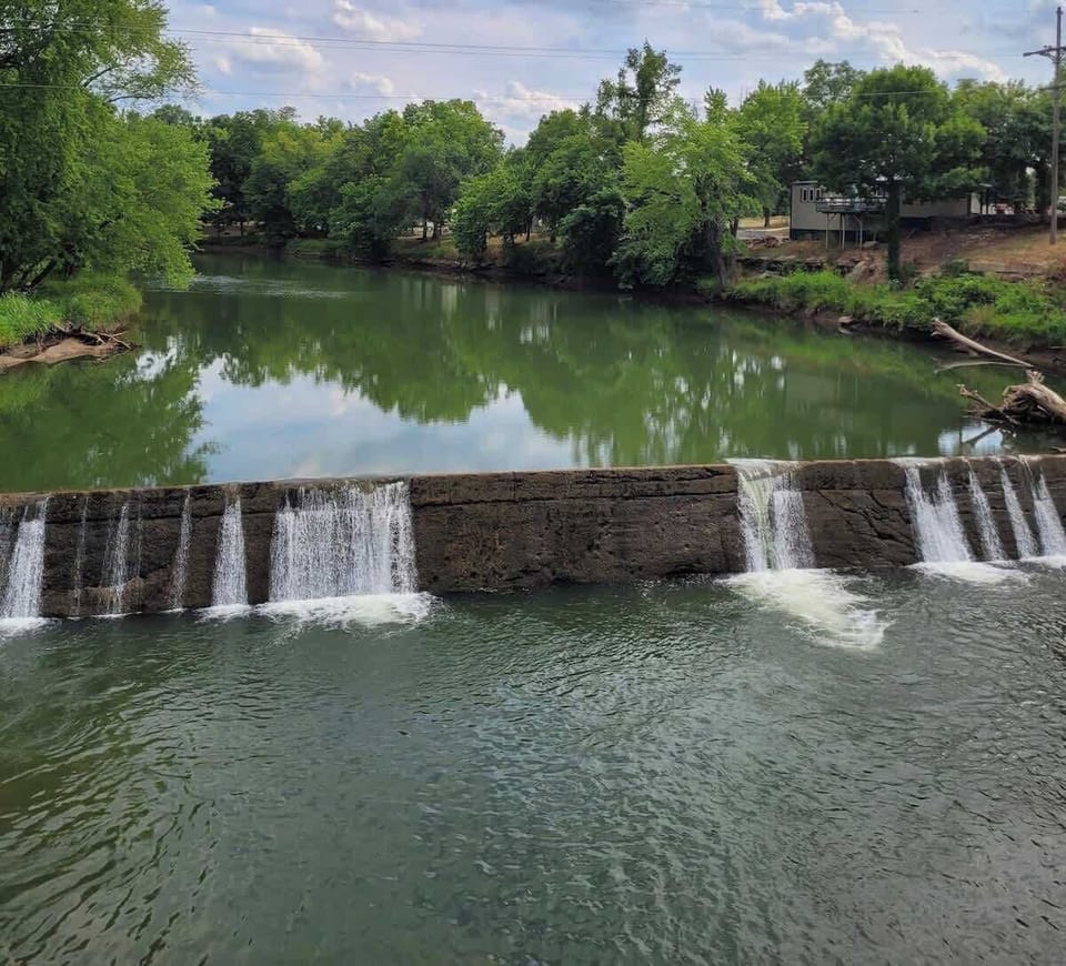 View of their Dam from the bridge.  The cabins are located in the background.  