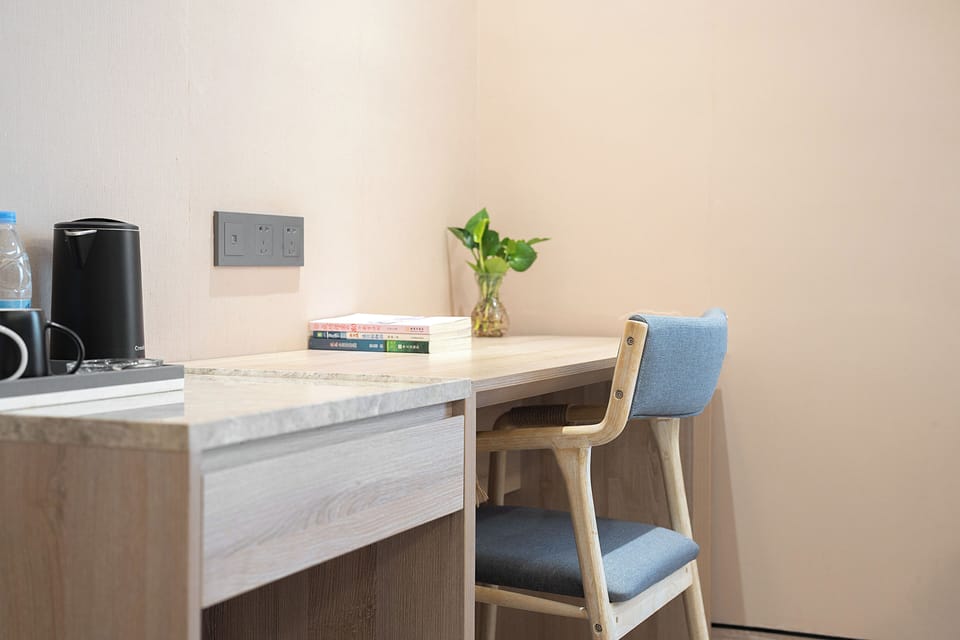 Business Twin Room | Desk, laptop workspace, blackout drapes, iron/ironing board