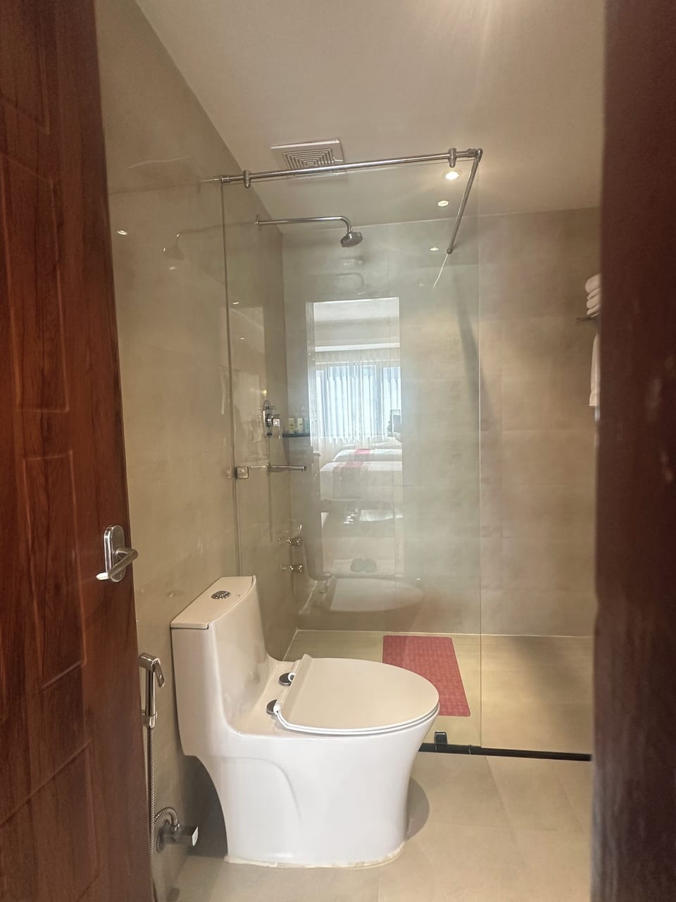 Shower, hair dryer, slippers, towels