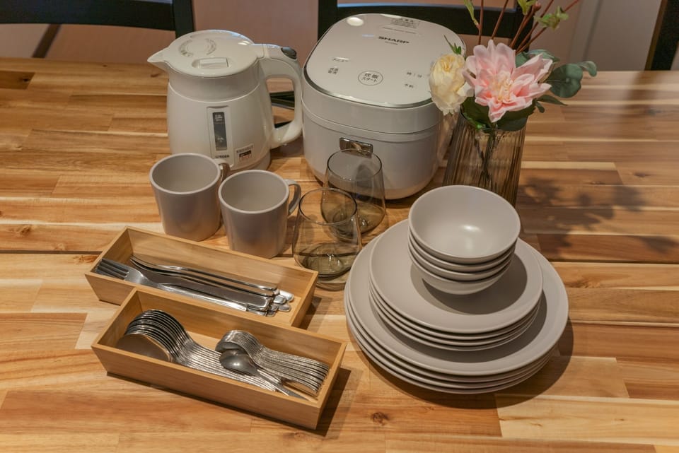 Comfort Villa | Private kitchen | Rice cooker, cleaning supplies, paper towels, dining tables
