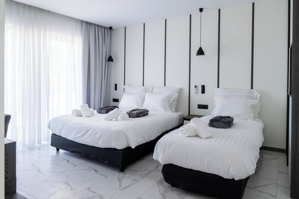 Family Room, Balcony, Garden View | In-room safe, laptop workspace, soundproofing, free WiFi