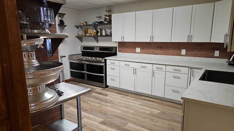 Second kitchen with two stoves, refrigerator and standing freezer