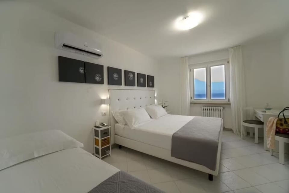 Classic Quadruple Room, Sea View | Minibar, in-room safe, desk, free WiFi