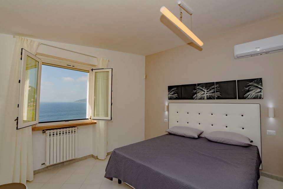 Classic Triple Room, Sea View | Minibar, in-room safe, desk, free WiFi