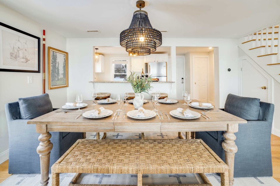 Enjoy family meals and gatherings at the spacious dining table for 8, conveniently located just steps from the kitchen for easy entertaining and effortless dining.