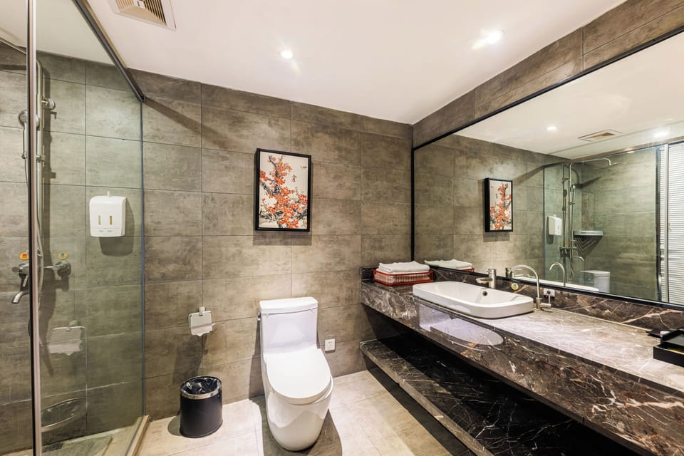 Family Quadruple Room | Bathroom | Shower, hair dryer, slippers, towels