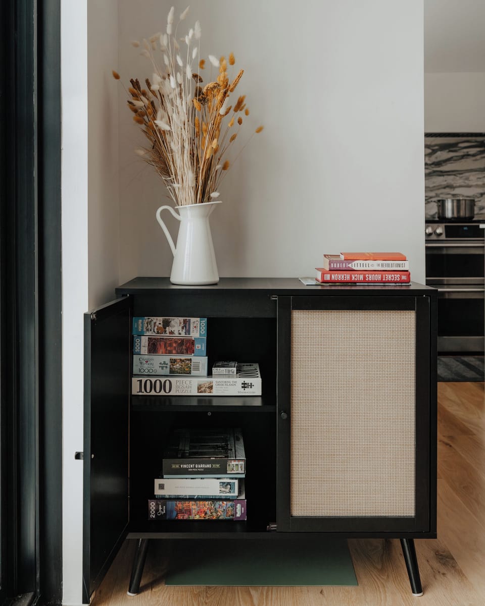 A curated collection of board games and puzzles, inviting friendly competition and cozy moments of leisure.