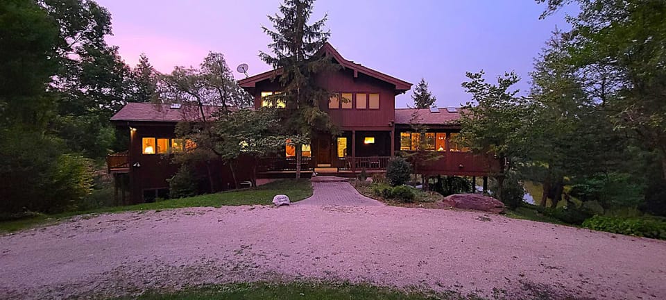 Grace Woods Lake house property can host up to 24 guests, with the Hideaway apartment and cabin all on one property. 