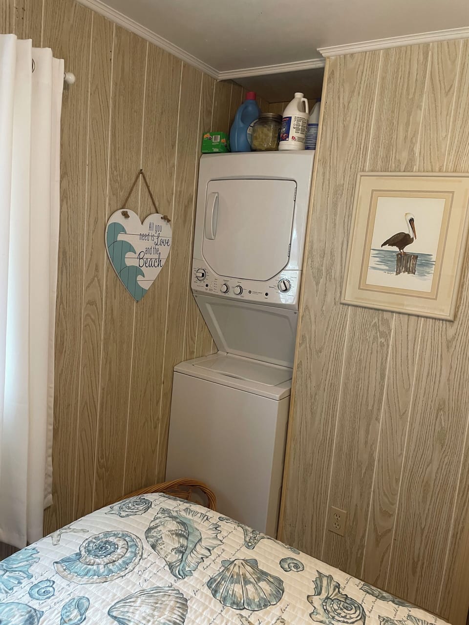 Washer and dryer tucked away in bedroom # two