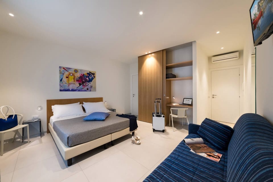 Basic Triple Room, Balcony | In-room safe, desk, blackout drapes, iron/ironing board