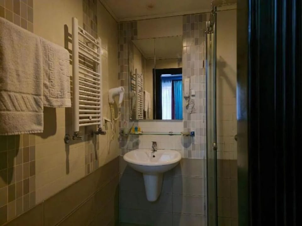 Executive Triple Room, City View | Bathroom | Hair dryer, slippers, towels, soap