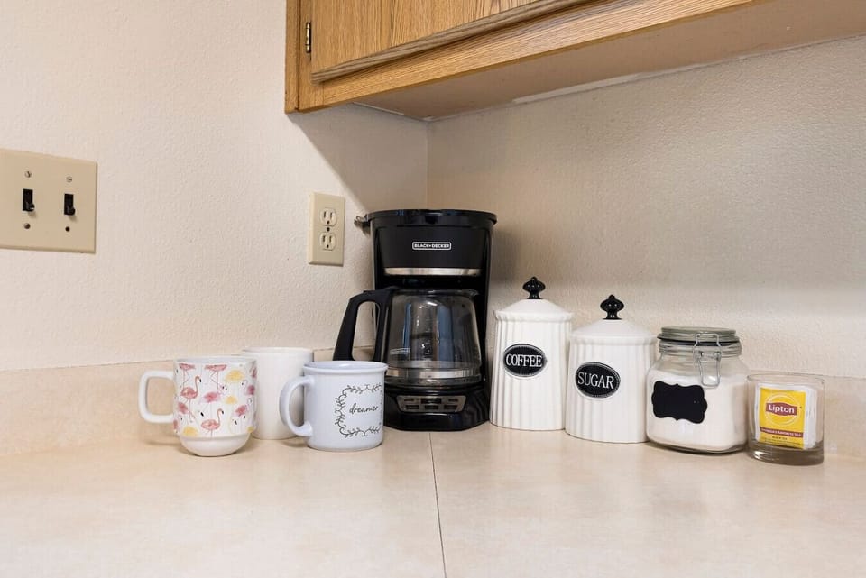 Convenient coffee station with mugs and essentials