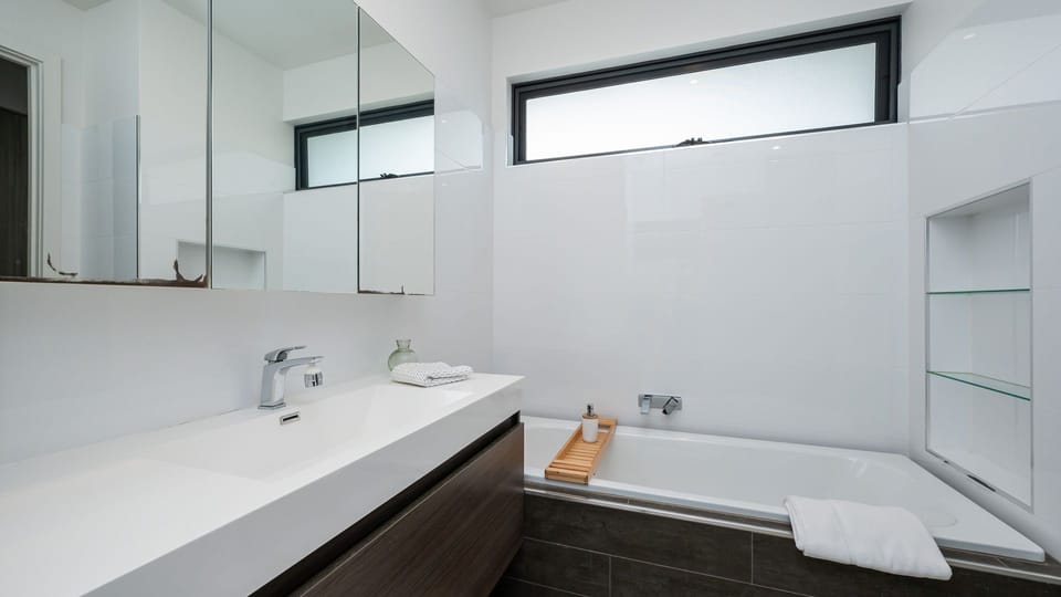 Bathroom with bath and shower