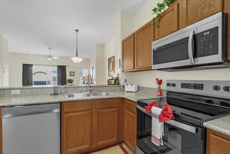 Newly updated kitchen with Quartz Counter tops, all stainless steel appliances.