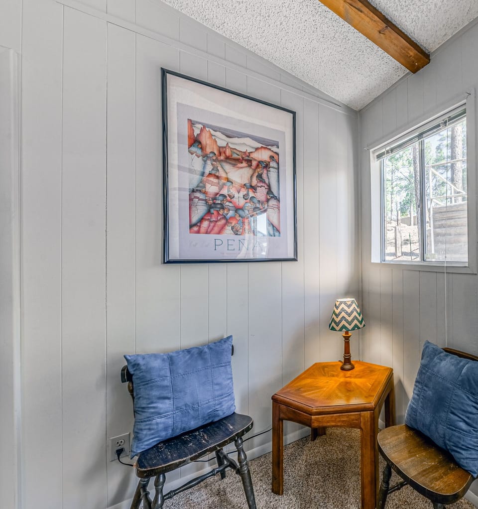 Additional 'reading nook' in living room with ample natural sunlight.