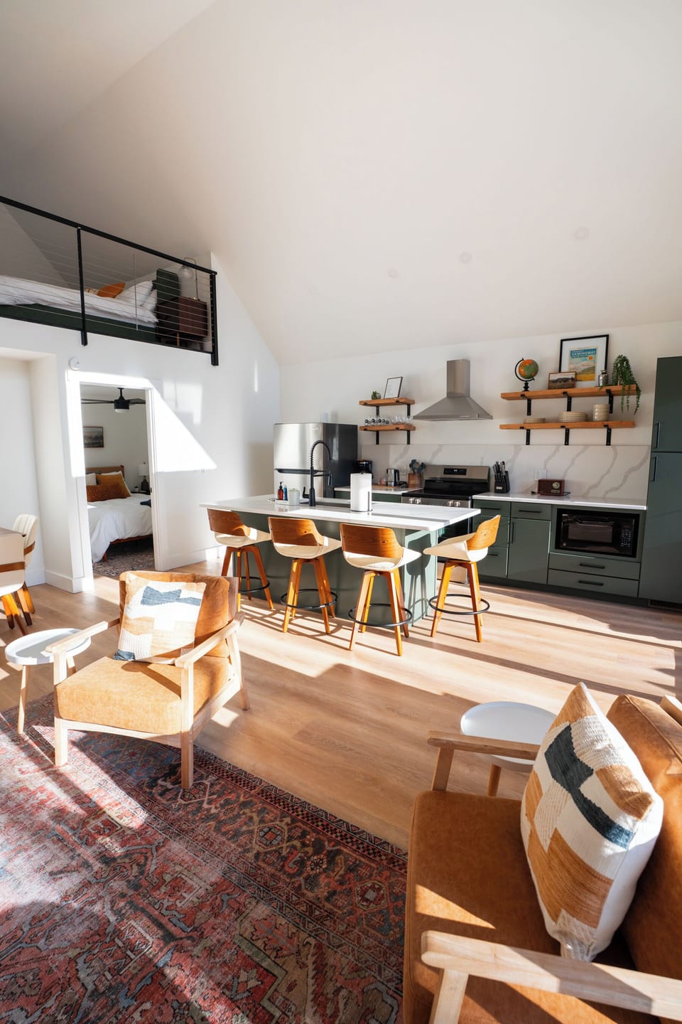 Main floor living and dining area at Hemingway — island seating, open concept layout, natural light from large windows