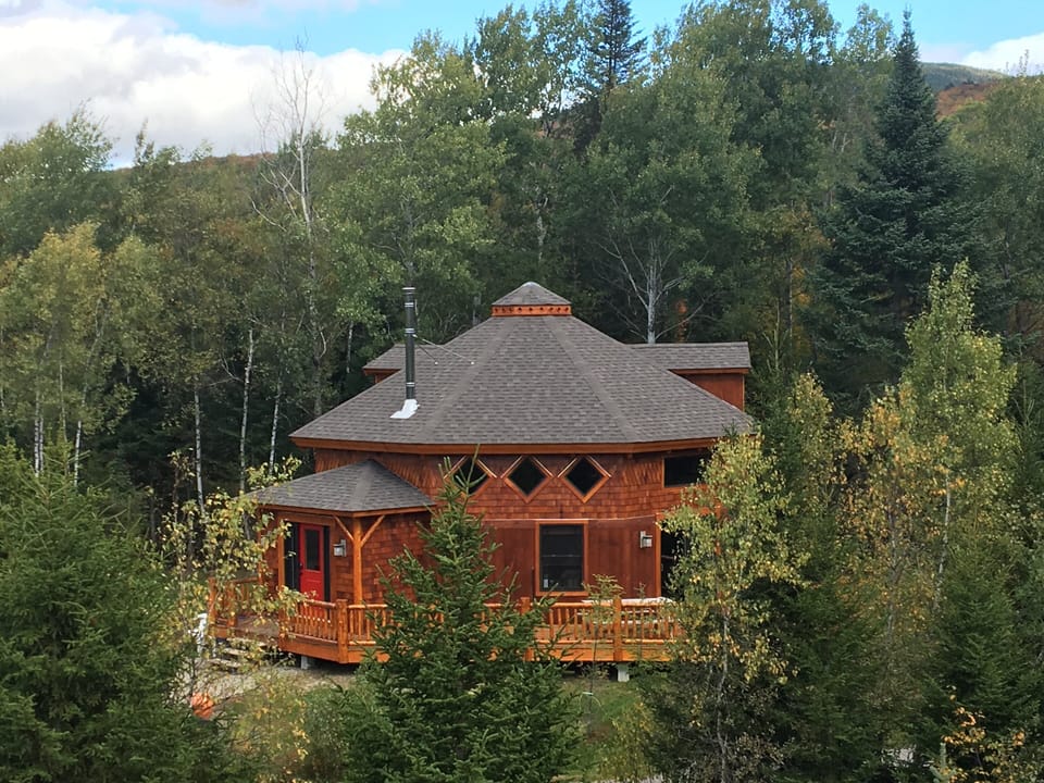 Designed for a luxury yurt-like experience with added comfort, Owl Roost features 3 bedrooms plus a loft, AC, hot tub, and fire pit. Highlights include a stunning spiral staircase, hand-carved by a Colorado artist around a standing dead tree!