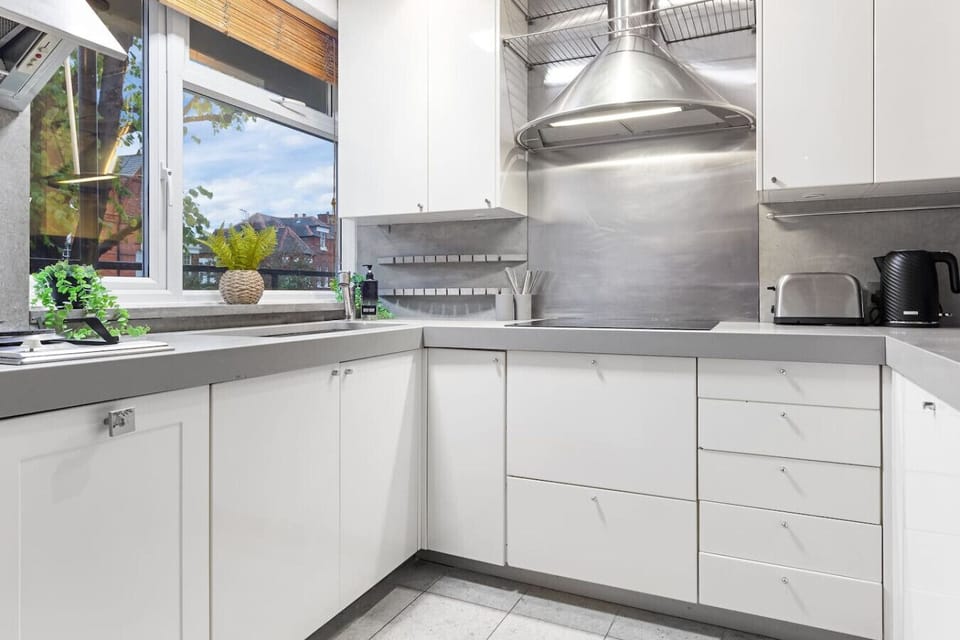 Enjoy cooking in this bright, fully stocked kitchen with plenty of counter space.