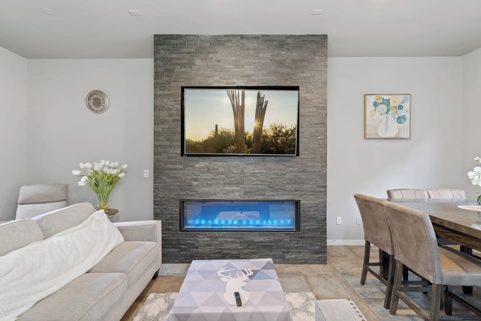 65" TV located in the living room with streaming content for family fun.