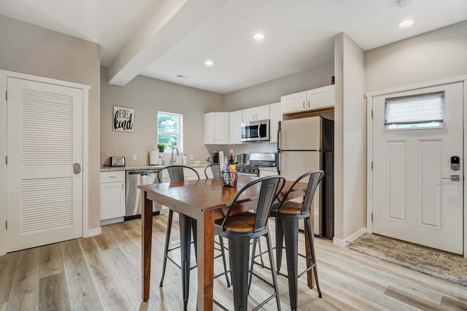 Cozy dining space with seating for four, seamlessly connected to the fully equipped kitchen for effortless meals and gatherings.





