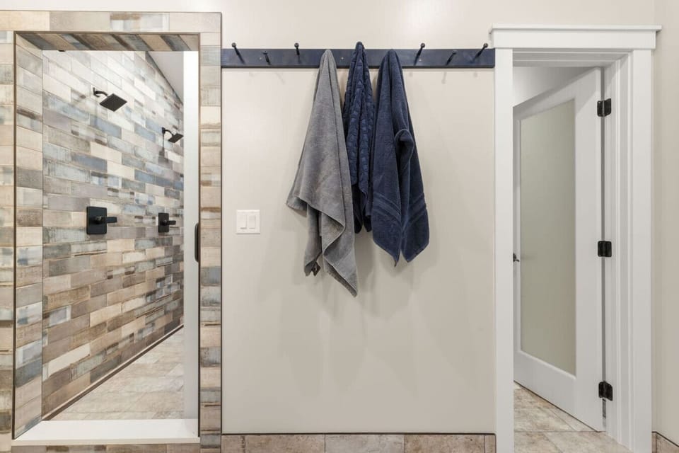 Primary Bathroom with Dual Vanities and Dual Walk in Shower