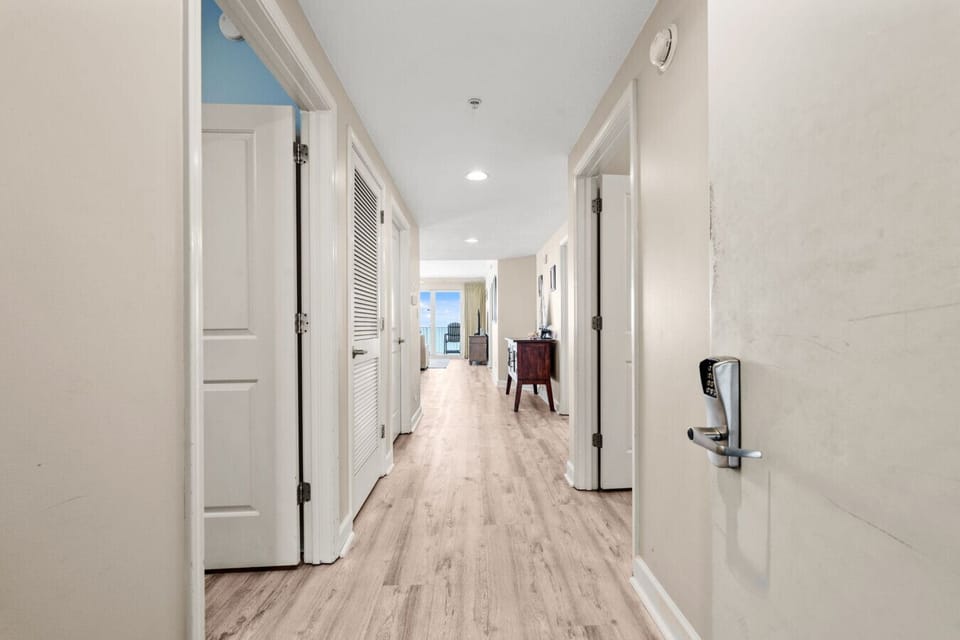 This bright hallway leads you through your Marisol condo to a private balcony overlooking the emerald waters of the Gulf.