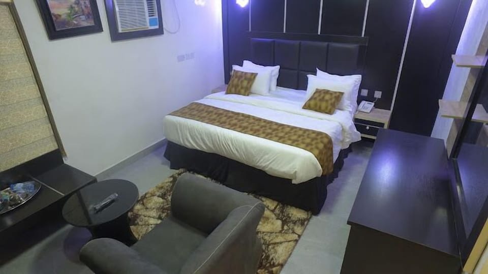 Deluxe Room, Balcony, City View | Desk, laptop workspace, blackout drapes, soundproofing