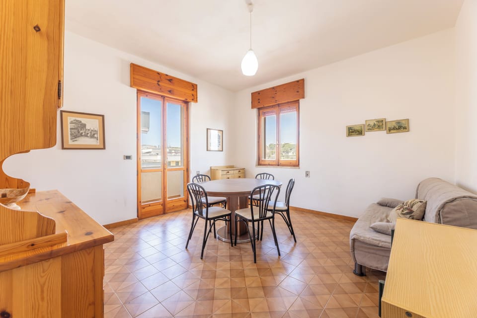 Apartment, Balcony, City View | Living area | 32-inch flat-screen TV with cable channels