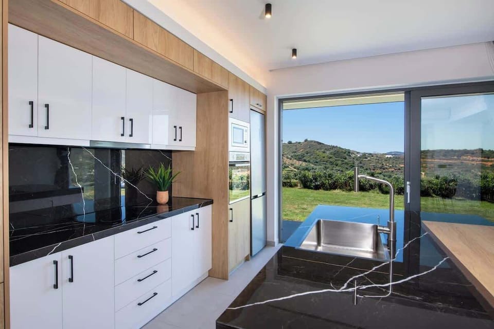 Sleek Fully Equipped Kitchen with Direct Outdoor Access