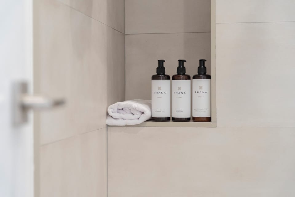 Deluxe Room, Balcony, City View | Bathroom | Shower, free toiletries, towels, soap