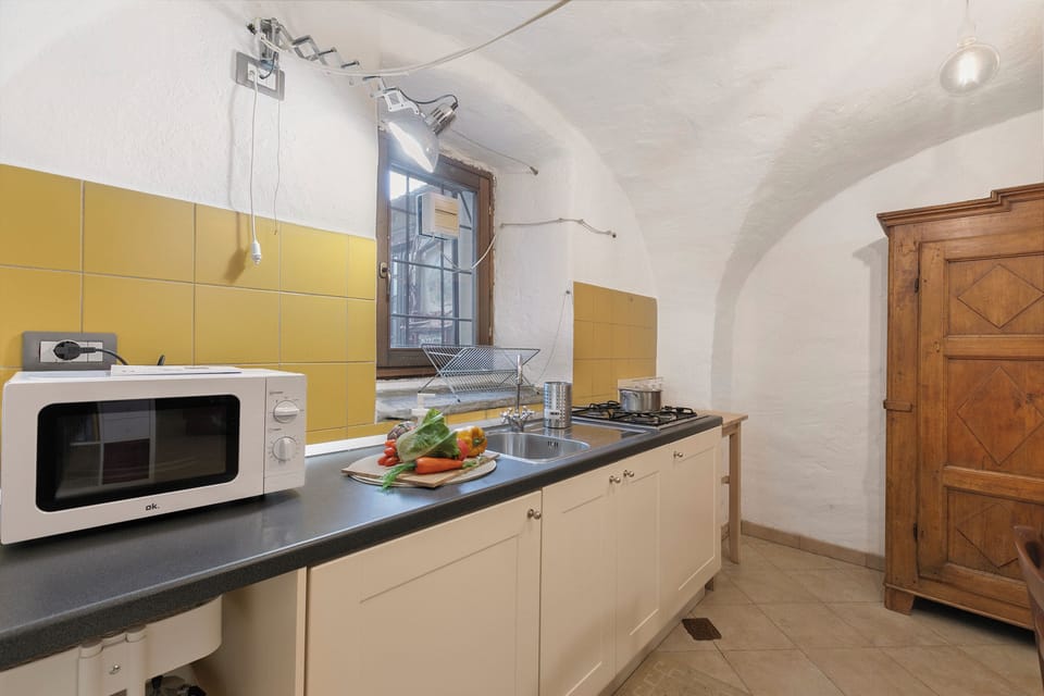 Standard Apartment, Multiple Bedrooms (La Casetta Del Borgo) | Private kitchen | Microwave, stovetop, electric kettle, cookware/dishes/utensils