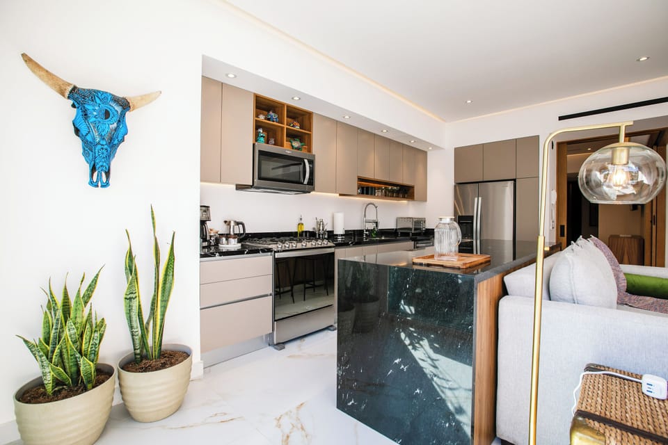 Fully equipped kitchen – includes a fridge, stove, oven, and dishwasher