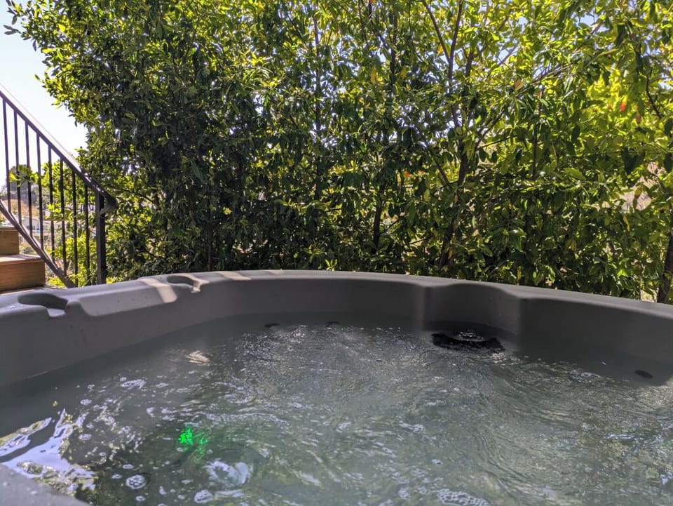 Soak in the ultimate comfort with a serene outdoor jacuzzi experience.