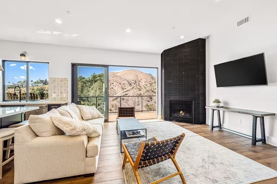 Cozy up in the living room with a warm fireplace and a TV ready for all your favorite streaming shows.