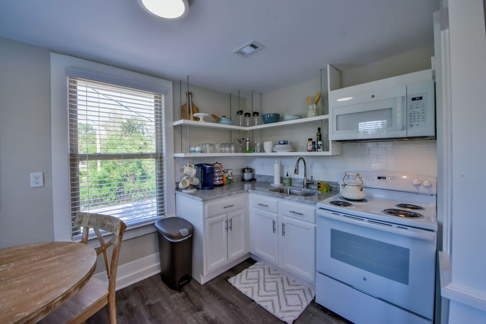 Kitchen - The kitchen is fully stocked to cook meals. There is also a coffee maker.
