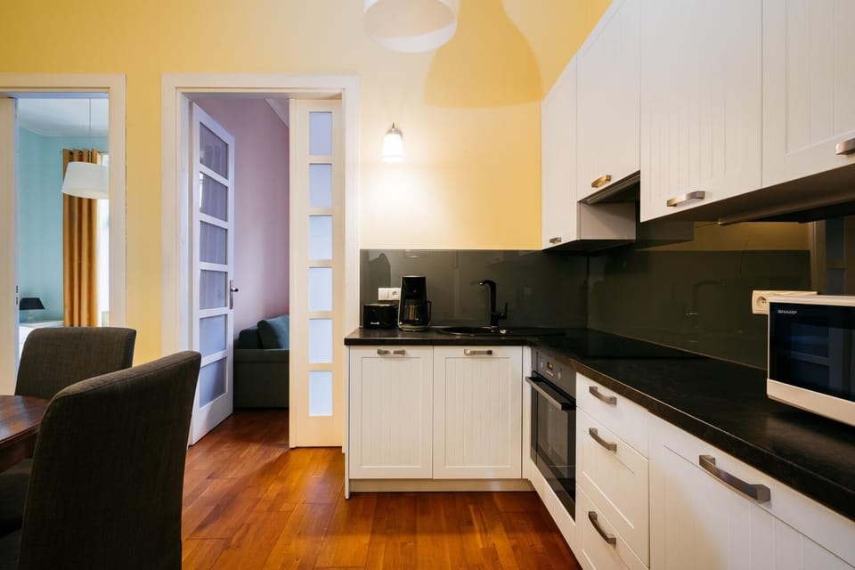 Apartment, City View | Private kitchen | Coffee/tea maker