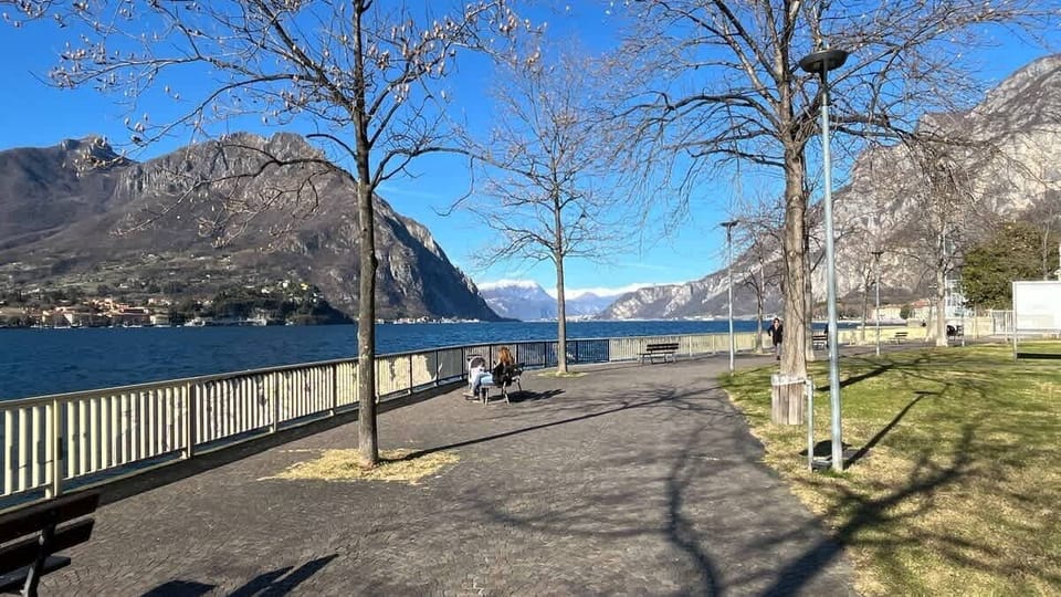 Complex exterior with mountain and lake view