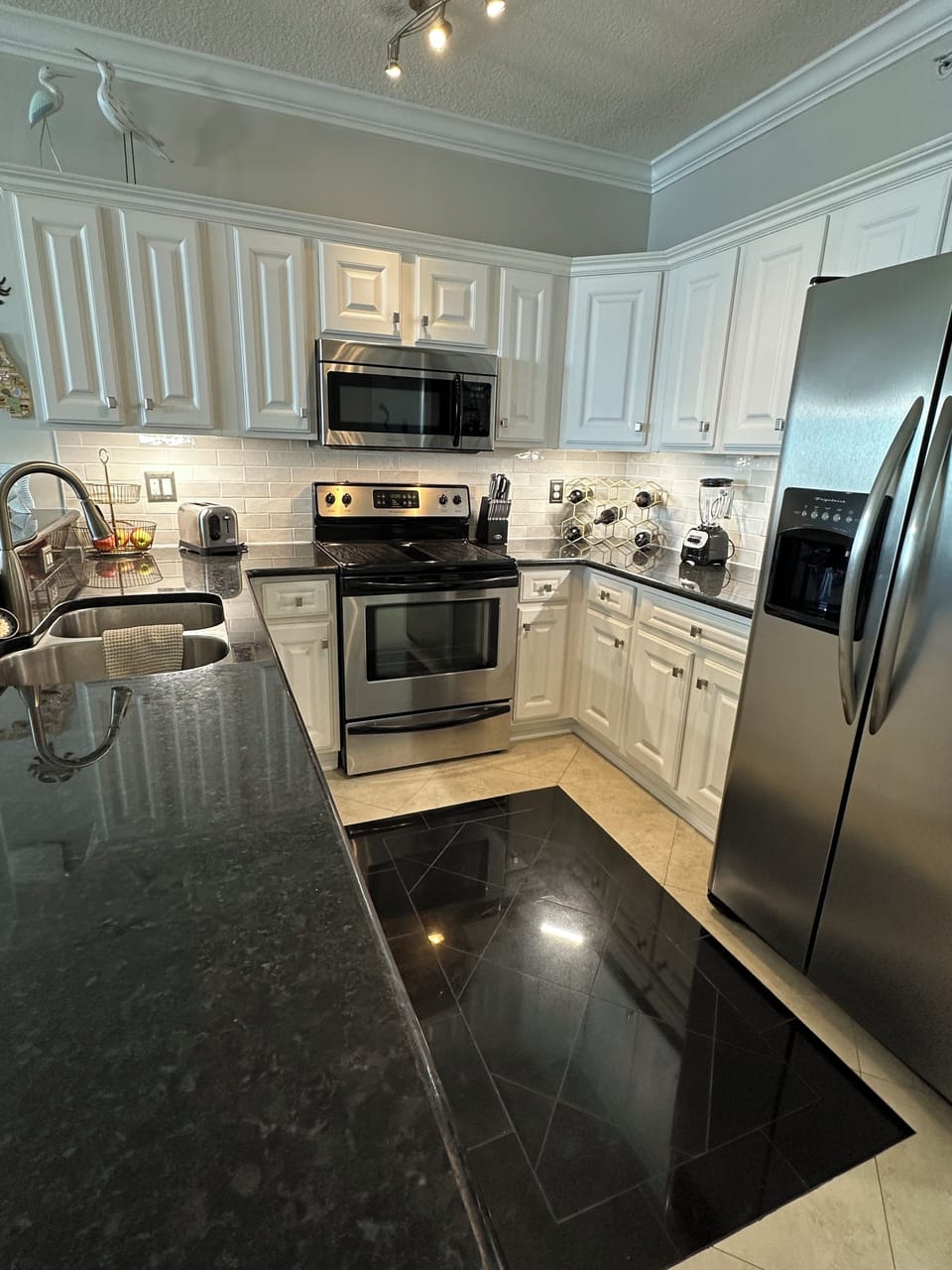 Kitchen has a Keurig and Mr. coffee maker, blender and housewares provided.