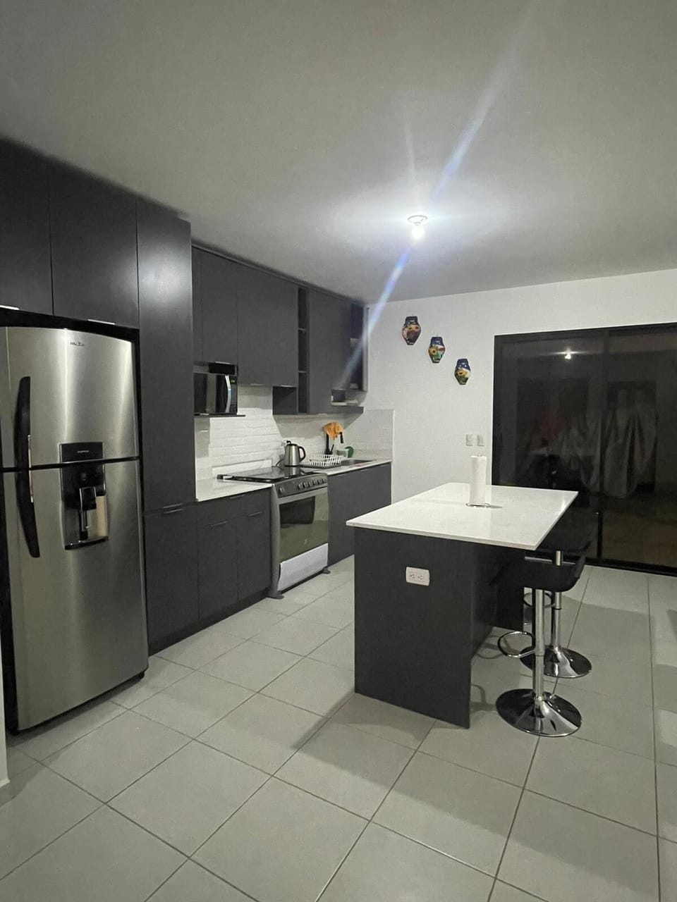 Kitchen with door to back patio