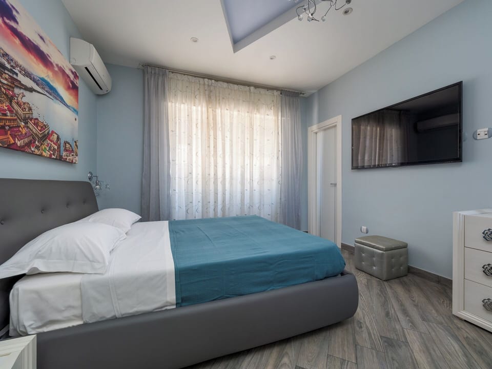 Luxury Apartment, Balcony, Partial Sea View | 2 bedrooms, blackout drapes, iron/ironing board, travel crib
