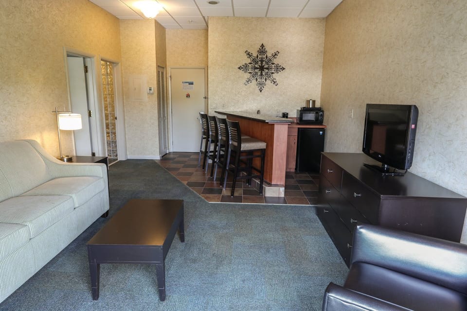 Living room with a sofa, dining table, and plenty of space for relaxing or entertaining.